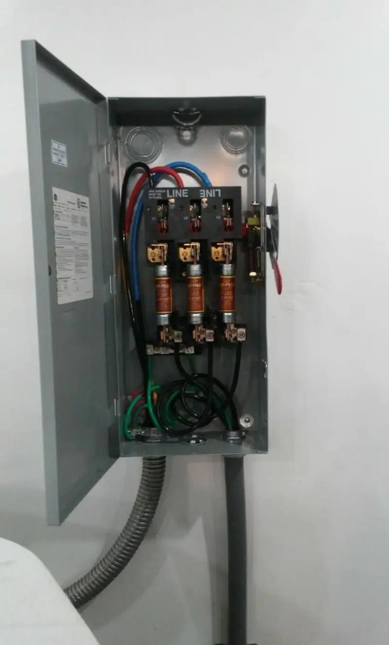 Three-phase disconnect switch installed for Smoke Detector Installation in Brick